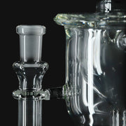 Clear glass Kadabra Hourglass Torus Incycler from 710 Pipes Smoke Shop featuring a frosted joint connection.