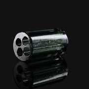 Kadabra black and UV glass tip from 710 Pipes Smoke Shop featuring a four-hole airflow design on a reflective surface.