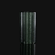 710 Pipes Smoke Shop Kadabra black and UV glass tip with a cylindrical, ribbed design on a black background.