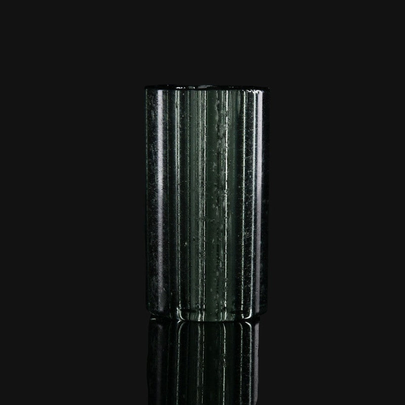 710 Pipes Smoke Shop Kadabra black and UV glass tip with a cylindrical, ribbed design on a black background.