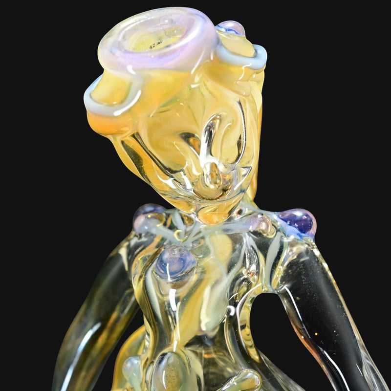710 Pipes Smoke Shop Lyric Princess Rig glass pipe with yellow and purple accents.