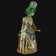 710 Pipes Smoke Shop Lyric Princess Rig in green and yellow glass, featuring intricate details and a flowing gown.