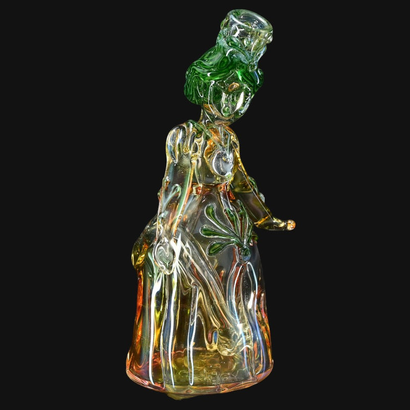710 Pipes Smoke Shop Lyric Princess Rig in green and yellow glass, featuring intricate details and a flowing gown.