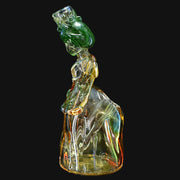 710 Pipes Smoke Shop Lyric Princess Rig in green and yellow glass, featuring a crown and flowing gown design.