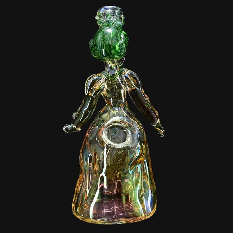 710 Pipes Smoke Shop Lyric Princess Rig in green and yellow glass, shaped like a woman in a gown.