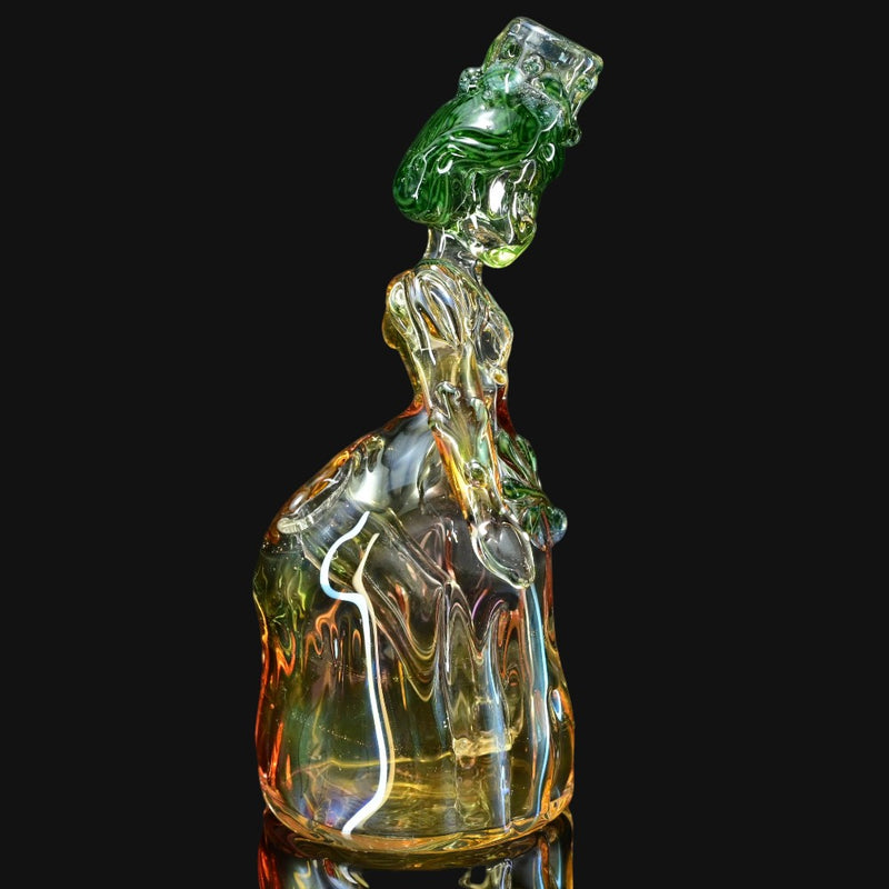710 Pipes Smoke Shop Lyric Princess Rig in green and yellow glass, featuring intricate details and a unique sculpted design.