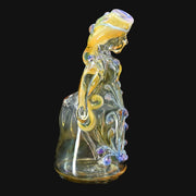 710 Pipes Smoke Shop Lyric Princess Rig in clear glass with purple and yellow accents, featuring intricate floral designs.