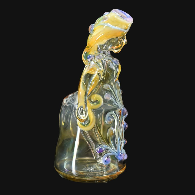 710 Pipes Smoke Shop Lyric Princess Rig in clear glass with purple and yellow accents, featuring intricate floral designs.