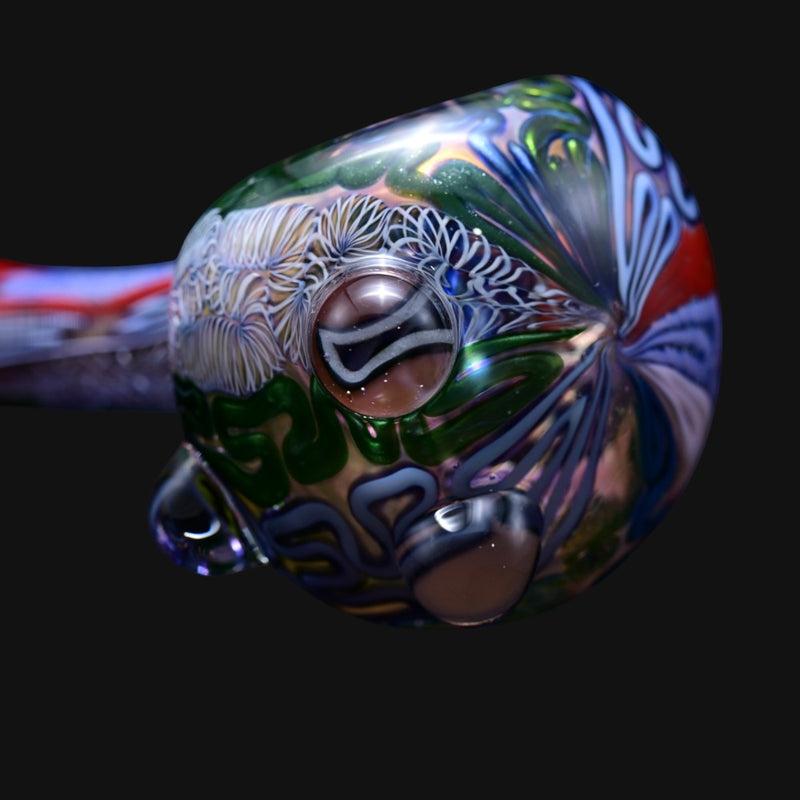 710 Pipes Smoke Shop Matty White Batman spoon pipe featuring intricate multi-colored glass patterns and thick glass
