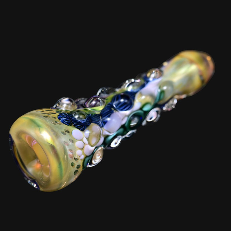 Matty White glass one hitter pipe with bumpy textured surface and blue and white accents