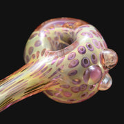 710 Pipes Smoke Shop Matty White glass spoon pipe featuring an iridescent dotted fume pattern on a cream base.