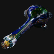 710 Pipes Smoke Shop Matty White thick glass spoon pipe featuring intricate blue, green, and gold patterned detailing.
