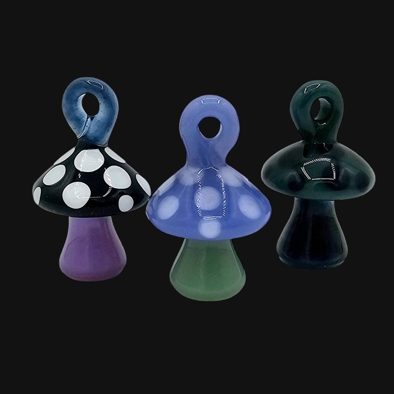 710 Pipes Smoke Shop Joker mushroom pendants in black, blue, and green glass with polka dot and solid designs.