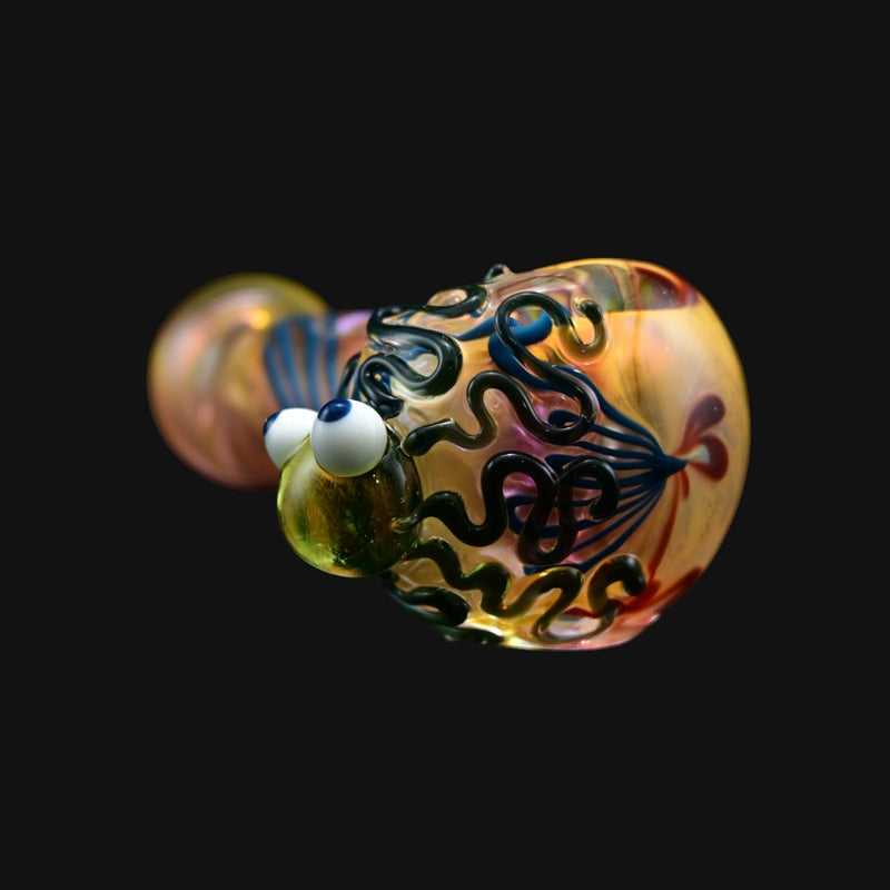 710 Pipes Smoke Shop octopus shaped glass spoon pipe with colorful swirling patterns and large white googly eyes
