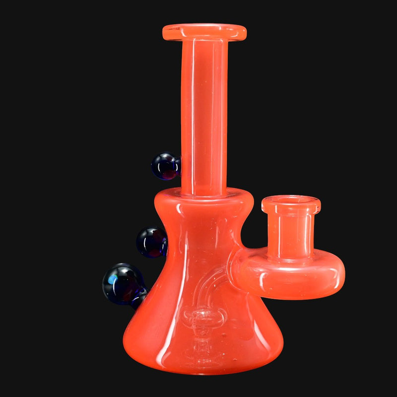 710 Pipes Smoke Shop orange glass water pipe with blue marble accents and a 14mm joint.