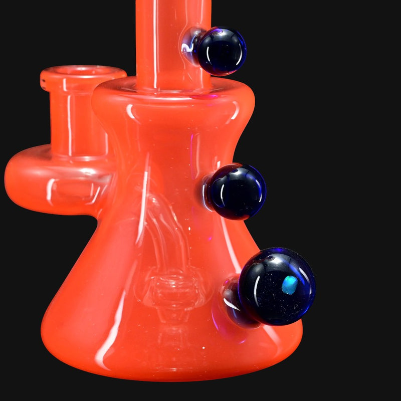710 Pipes Smoke Shop orange glass water pipe with 14mm joint and blue marble accents.