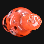 710 Pipes Smoke Shop Ras Glass orange crayon spinner bubble cap featuring a detailed skull millie design.