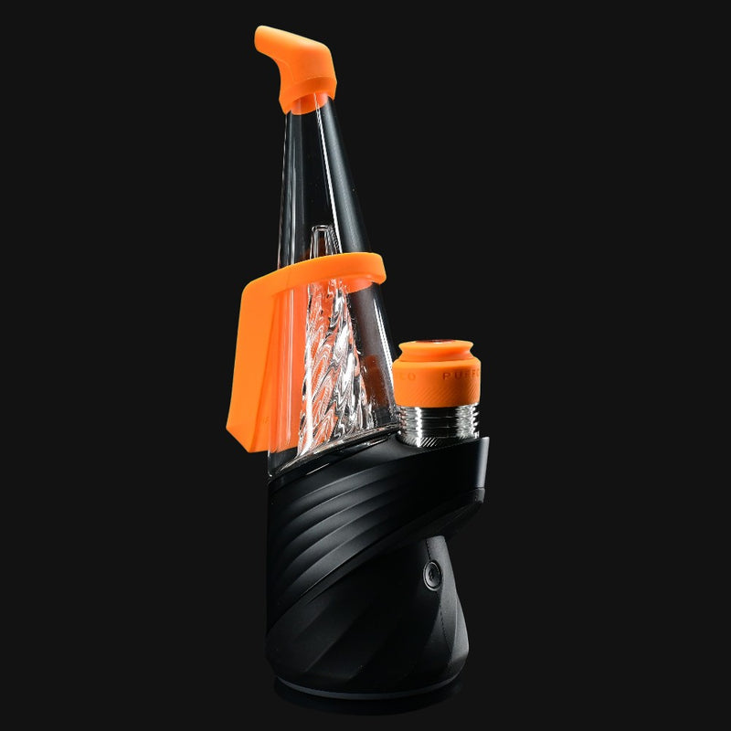 710 Pipes Smoke Shop Peak Pro Travel Pack with orange silicone mouthpiece, carb cap, and tether on a black vaporizer