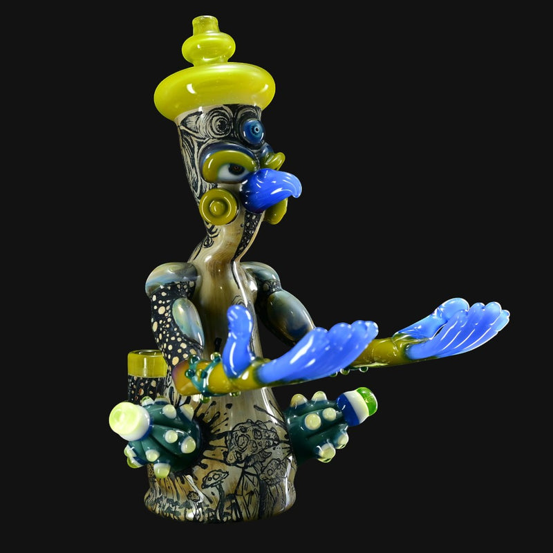 710 Pipes Smoke Shop Peyote Sight Eagle glass art piece by Aaron Brooks & Creep Eagle. Features blue hands, yellow hat, and intricate black line art.