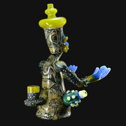 710 Pipes Smoke Shop Peyote Sight Eagle glass water pipe with yellow accents, blue hands, and mushroom designs.