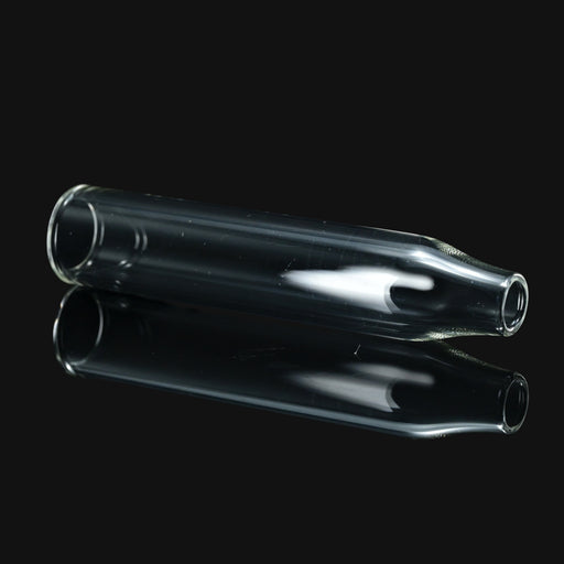 Clear glass replacement mouthpiece for Puffco devices from 710 Pipes Smoke Shop on a black reflective surface.