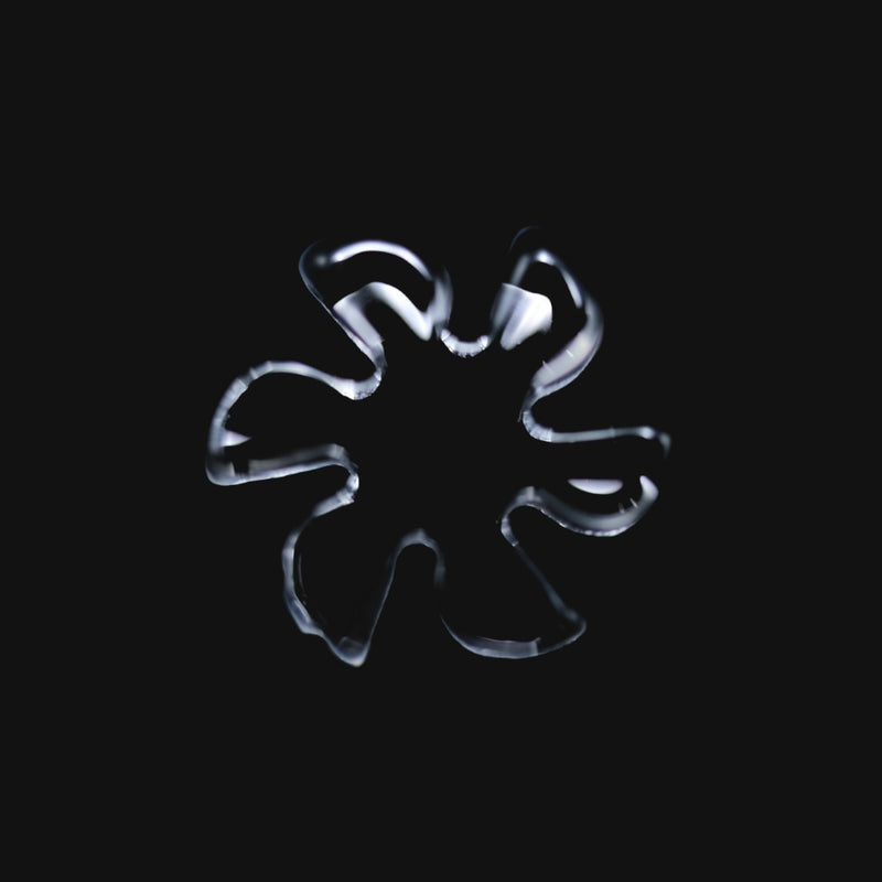 710 Pipes Smoke Shop Black Market Glass 13mm quartz flake with 6 blades, clear glass accessory on black background.