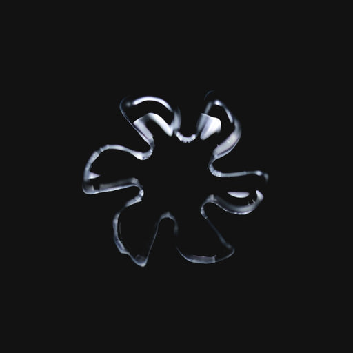 710 Pipes Smoke Shop Black Market Glass 13mm quartz flake with 6 blades, clear glass accessory on black background.