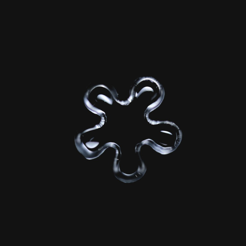 710 Pipes Smoke Shop Black Market Glass 11mm quartz flake with five rounded blades on a black background