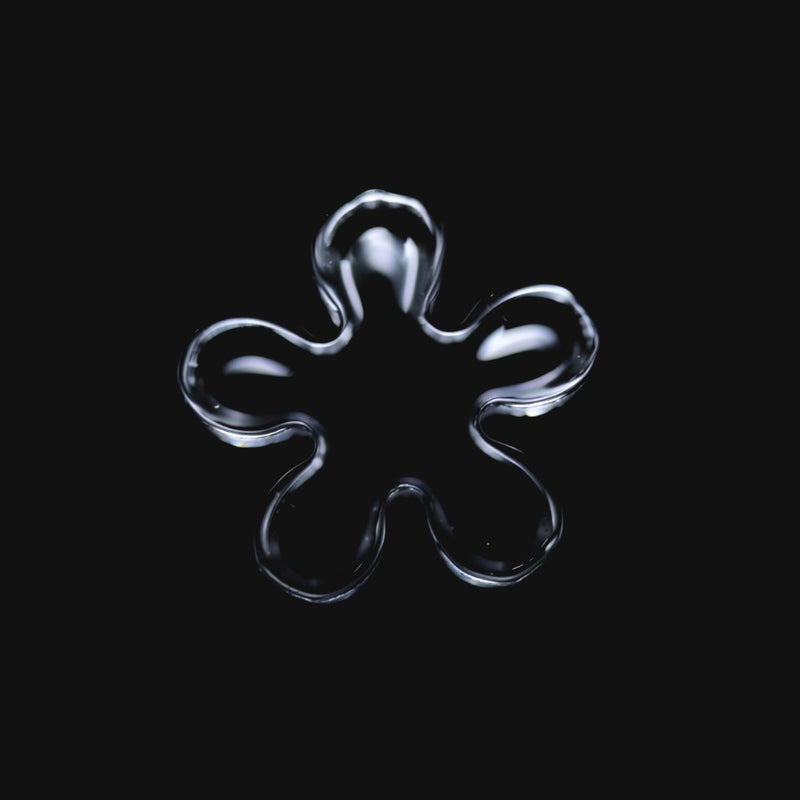 710 Pipes Smoke Shop Black Market Glass 12mm quartz flake with five rounded blades on a black background