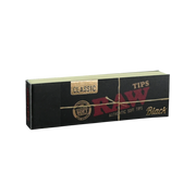 710 Pipes Smoke Shop RAW Black Classic rolling paper tips in a black rectangular booklet with gold foil branding