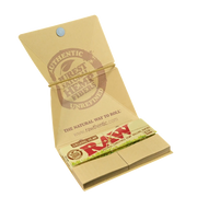 710 Pipes Smoke Shop Raw organic hemp 1 1/4 rolling paper kit in a tan cardboard booklet with elastic closure