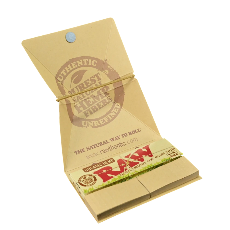 710 Pipes Smoke Shop Raw organic hemp 1 1/4 rolling paper kit in a tan cardboard booklet with elastic closure