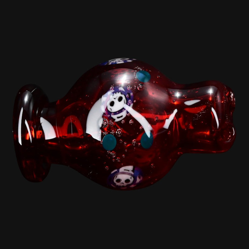 710 Pipes Smoke Shop red Ras Glass millie bubble cap featuring intricate skull and floral glasswork designs.