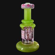 710 Pipes Smoke Shop RL. Dots Jammer glass water pipe with green base and accents, pink floral pattern, and clear glass downstem.