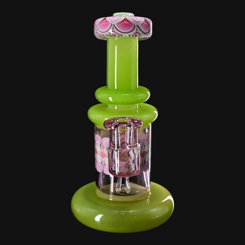 710 Pipes Smoke Shop RL. Dots Jammer glass water pipe with green base and accents, pink floral pattern, and clear glass downstem.