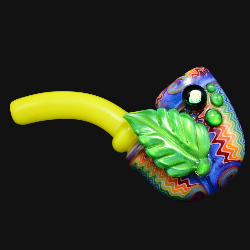 710 Pipes Smoke Shop Sherlock pipe with yellow mouthpiece, green leaf accent, and rainbow chevron pattern.