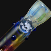 710 Pipes Smoke Shop Matty White Goldie one hitter glass pipe featuring a skull and crossbones design and blue dots.