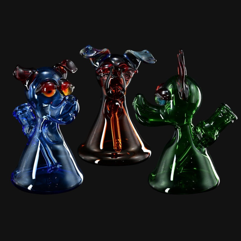 Three T_Tree Glass Ruffer dog-shaped glass jammers in blue, amber, and green from 710 Pipes Smoke Shop