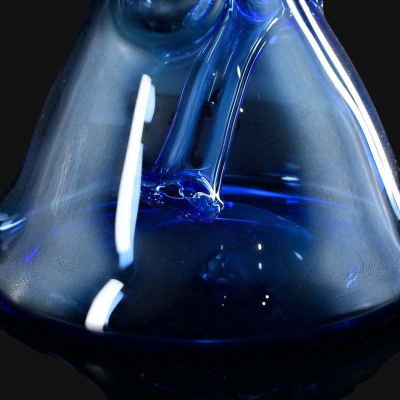 T_Tree Glass Ruffer jammer in deep blue glass from 710 Pipes Smoke Shop, featuring a sleek beaker base design.