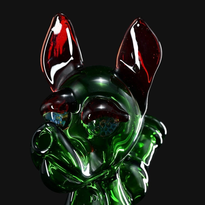 710 Pipes Smoke Shop T_Tree Glass Ruffer jammer featuring a green glass creature design with dark red ears.