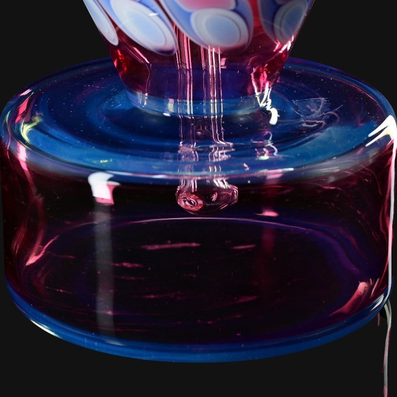 710 Pipes Smoke Shop RL Dots Talus Rig #1, a 6-inch glass rig with a 14mm joint, featuring a blue base and pink accents with white dots.