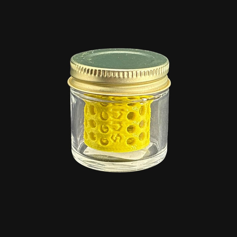710 Pipes Smoke Shop terp pearl washing station with a yellow plastic insert inside a small glass jar with a metal lid.