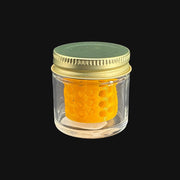 710 Pipes Smoke Shop terp pearl washing station with a clear glass jar, gold lid, and yellow honeycomb insert.
