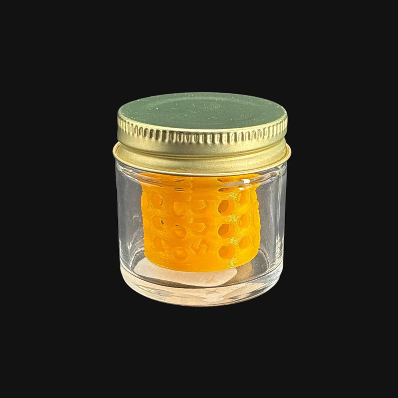 710 Pipes Smoke Shop terp pearl washing station with a clear glass jar, gold lid, and yellow honeycomb insert.