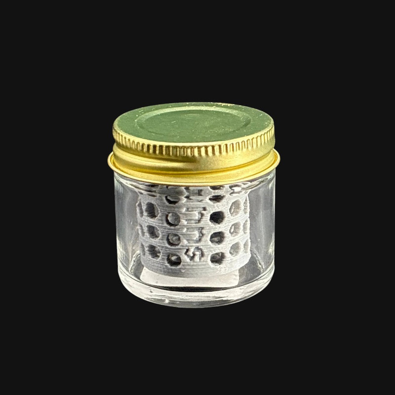710 Pipes Smoke Shop terp pearl washing station with a clear glass jar and gold lid for cleaning dab accessories.
