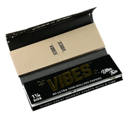 710 Pipes Smoke Shop Vibes 1 1/4 size ultra thin rolling papers with integrated filter tips in black packaging