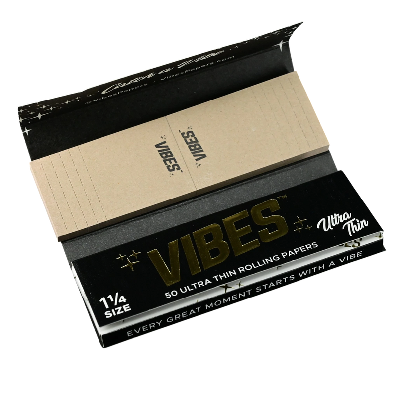 710 Pipes Smoke Shop Vibes 1 1/4 size ultra thin rolling papers with integrated filter tips in black packaging
