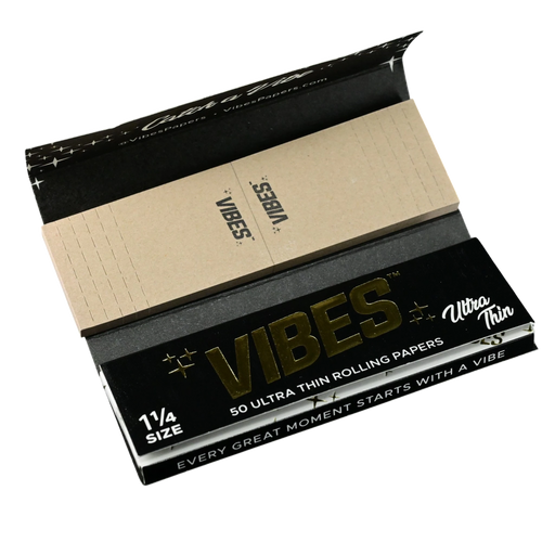 710 Pipes Smoke Shop Vibes 1 1/4 size ultra thin rolling papers with integrated filter tips in black packaging