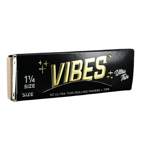 710 Pipes Smoke Shop Vibes 1 1/4 size ultra thin rolling papers and tips in black packaging with gold lettering.