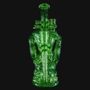 W.C. Stearns transparent green glass recycler dab rig with gold dichro and coral-style attachments.
